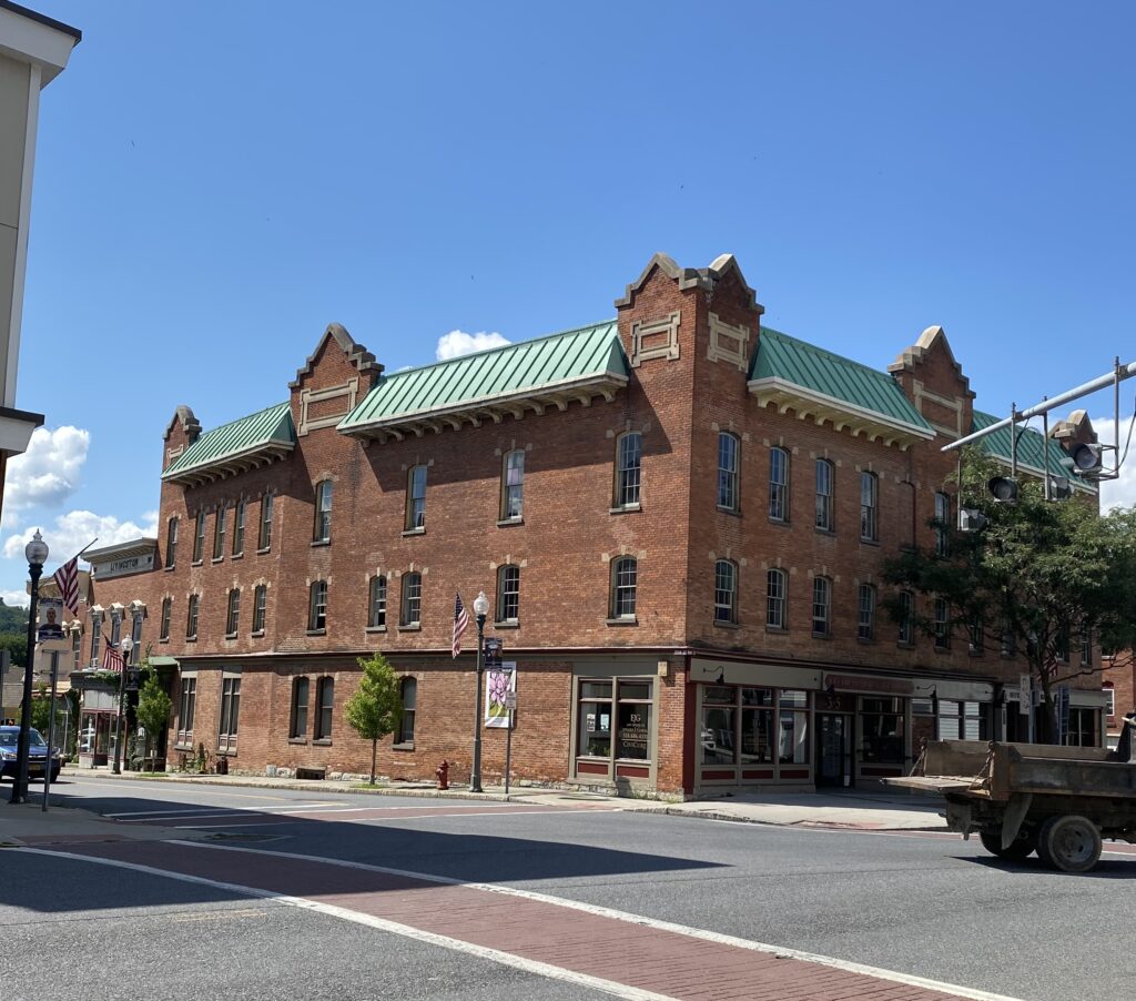 photograph of exterior of large brick building known as Wood Block